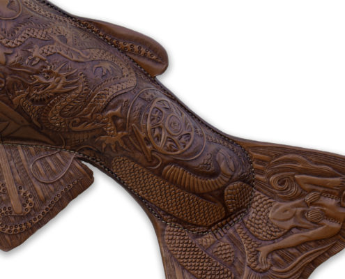 Tattooed Trout, a leather sculpture of a trout with hand tooled images of a Bigfoot, lochness monster, mermaid, and other fictional characters.
